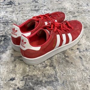 Red Adidas low cut shoes